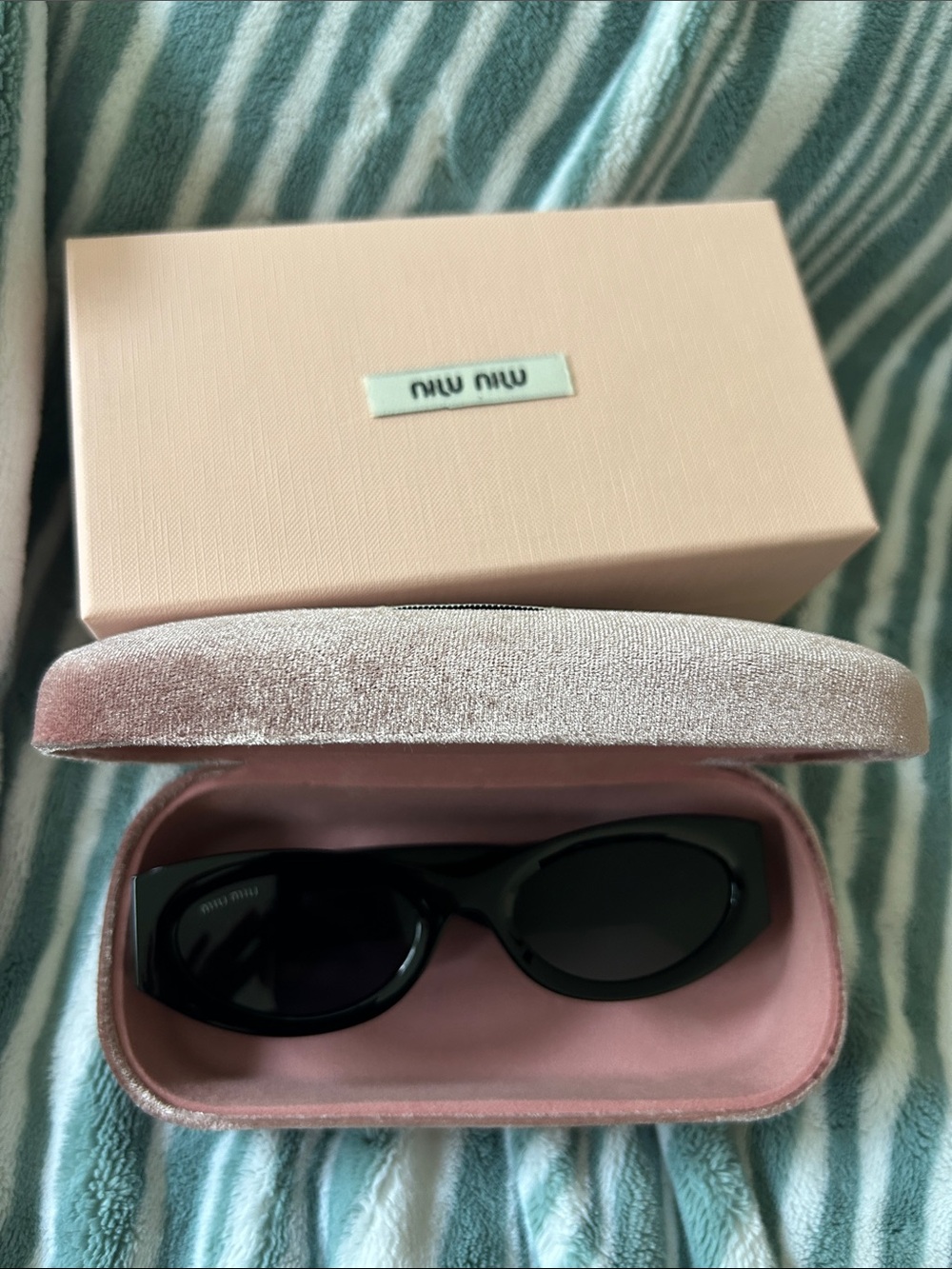 Miu Miu Black Oval Women's Sunglasses with Pink Velvet Case